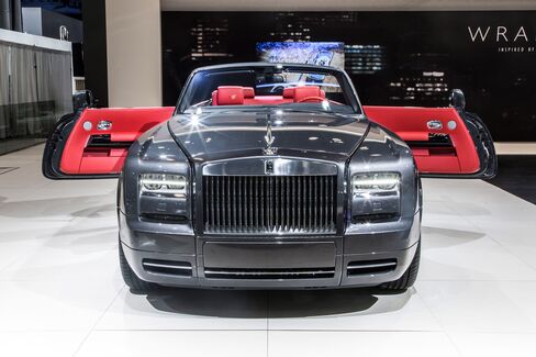 The coupe's Spirit of Ecstasy hood ornament is illuminated from the bottom.
