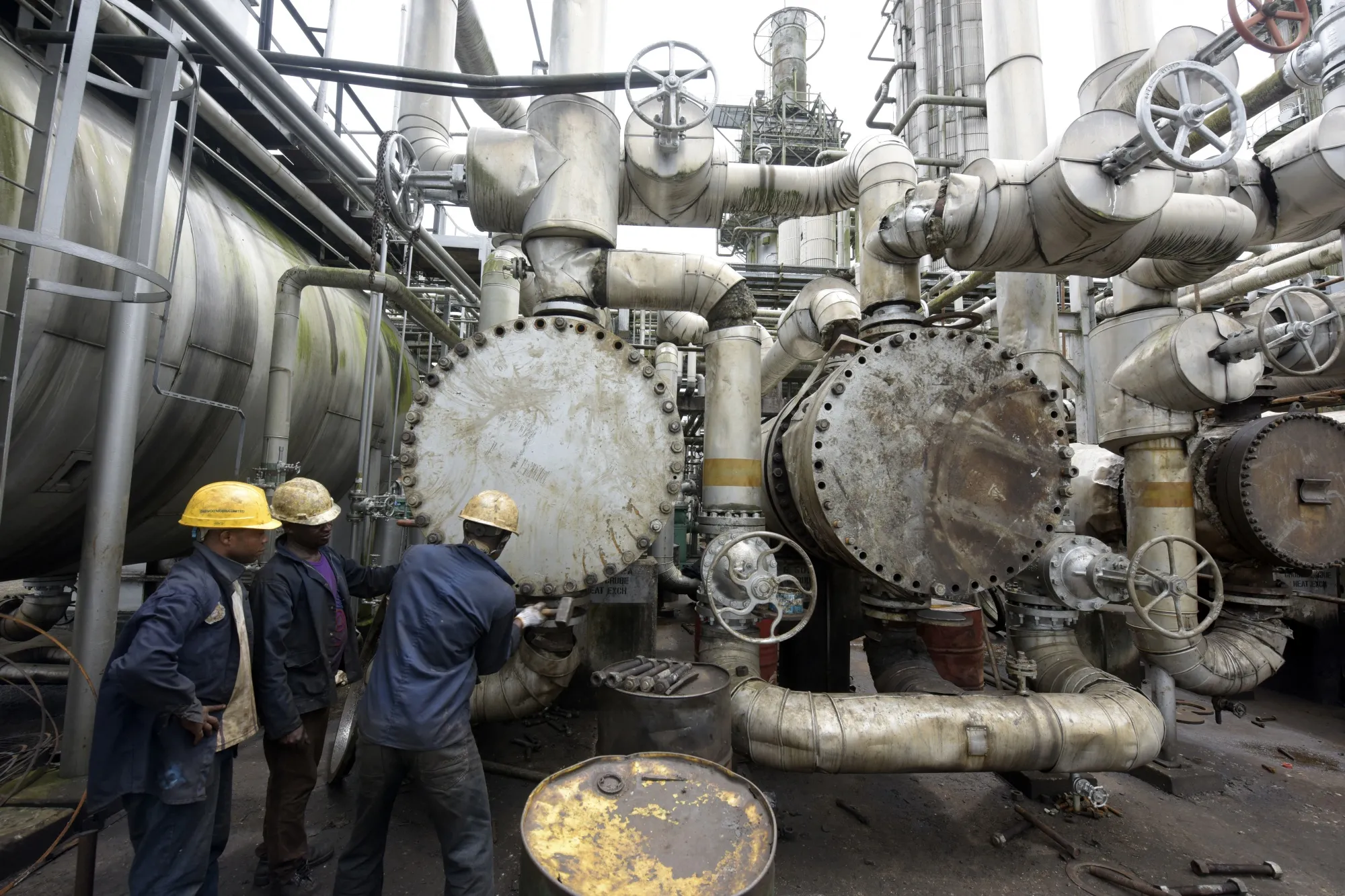Workers work at a refinery in Port Harcourt, Nigeria.&nbsp;
