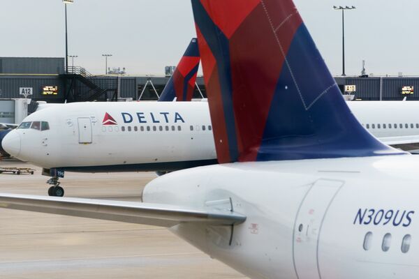 Travelers At Hartsfield–Jackson Atlanta International Airport Ahead Of Christmas Holiday