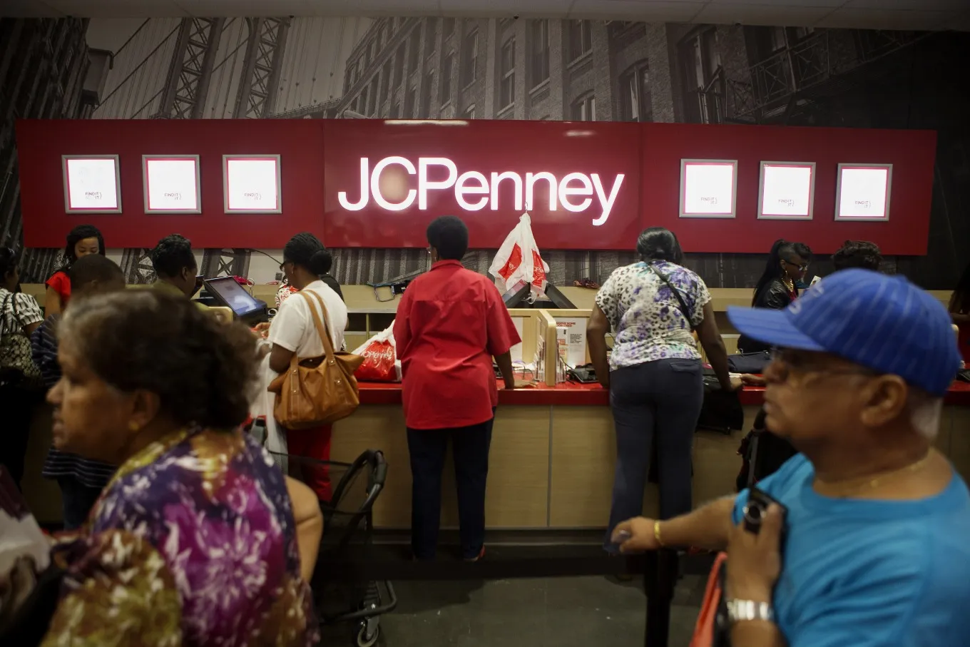 Customers line up to check-out during the grand opening of the new J.C. Penney Co. store in the Brooklyn.