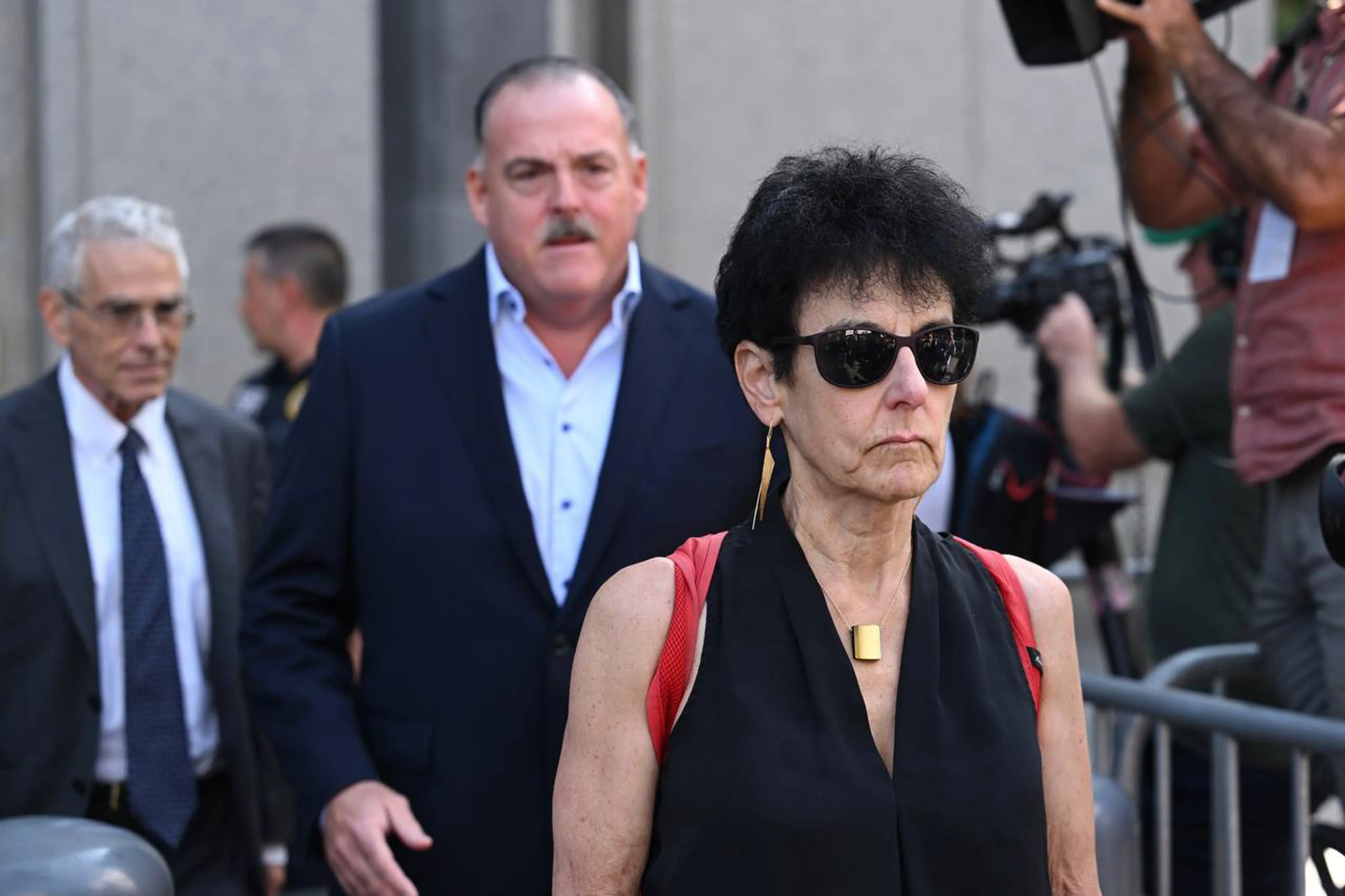 Allan Joseph Bankman, left, and Barbara Fried, right,&nbsp;leave&nbsp;after a bail hearing for their son, along with lawyers, at Manhattan Federal Court in New York, on Aug. 11.