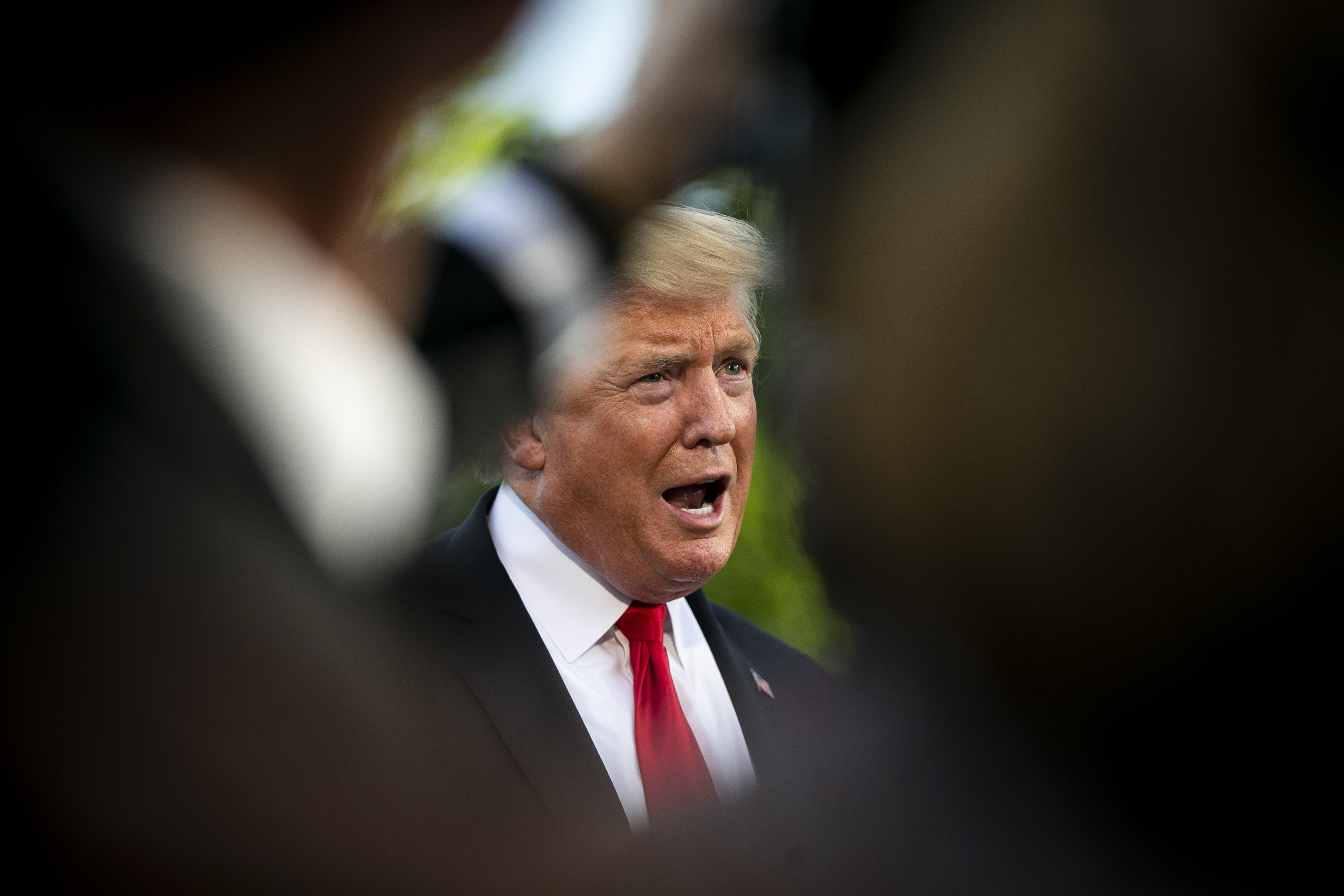 U.S. President Donald Trump speaks to members of the media before boarding Marine One on the South Lawn of the White House in Washington, D.C., U.S., on Monday, May 20, 2019. Trump is heading to Pennsylvania to campaign for Republican Fred Keller.