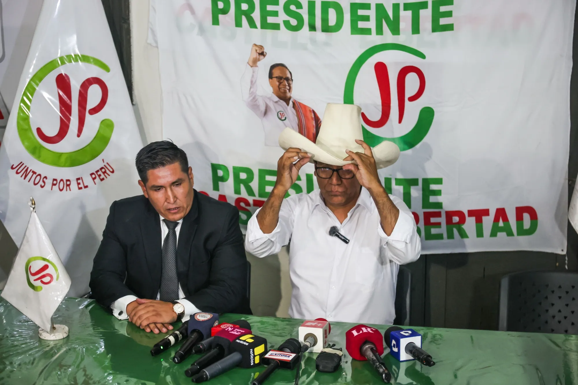 Roberto Sánchez, right, speaks during a news conference at the Together for Peru party headquarters in Lima on April 14.