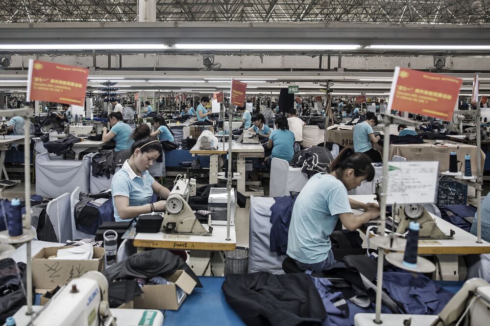 Employees make suits at a factory operated by the Shandong Ruyi Technology Group in Jining, China in 2016.