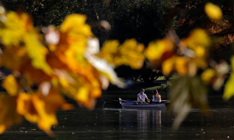 Boaters on a lake in Paris's Bois de Vincennes, where the new clothing optional mini-park is located.