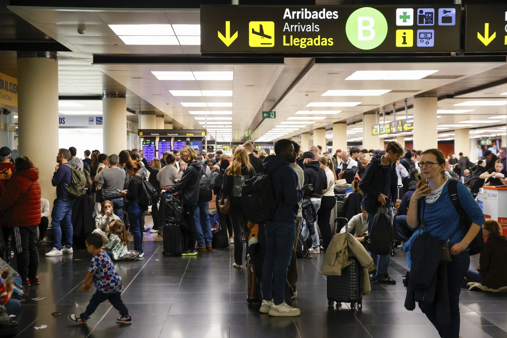 Travelers at Barcelona-El Prat airport, where flights were redirected due to storms, on Nov. 4. 