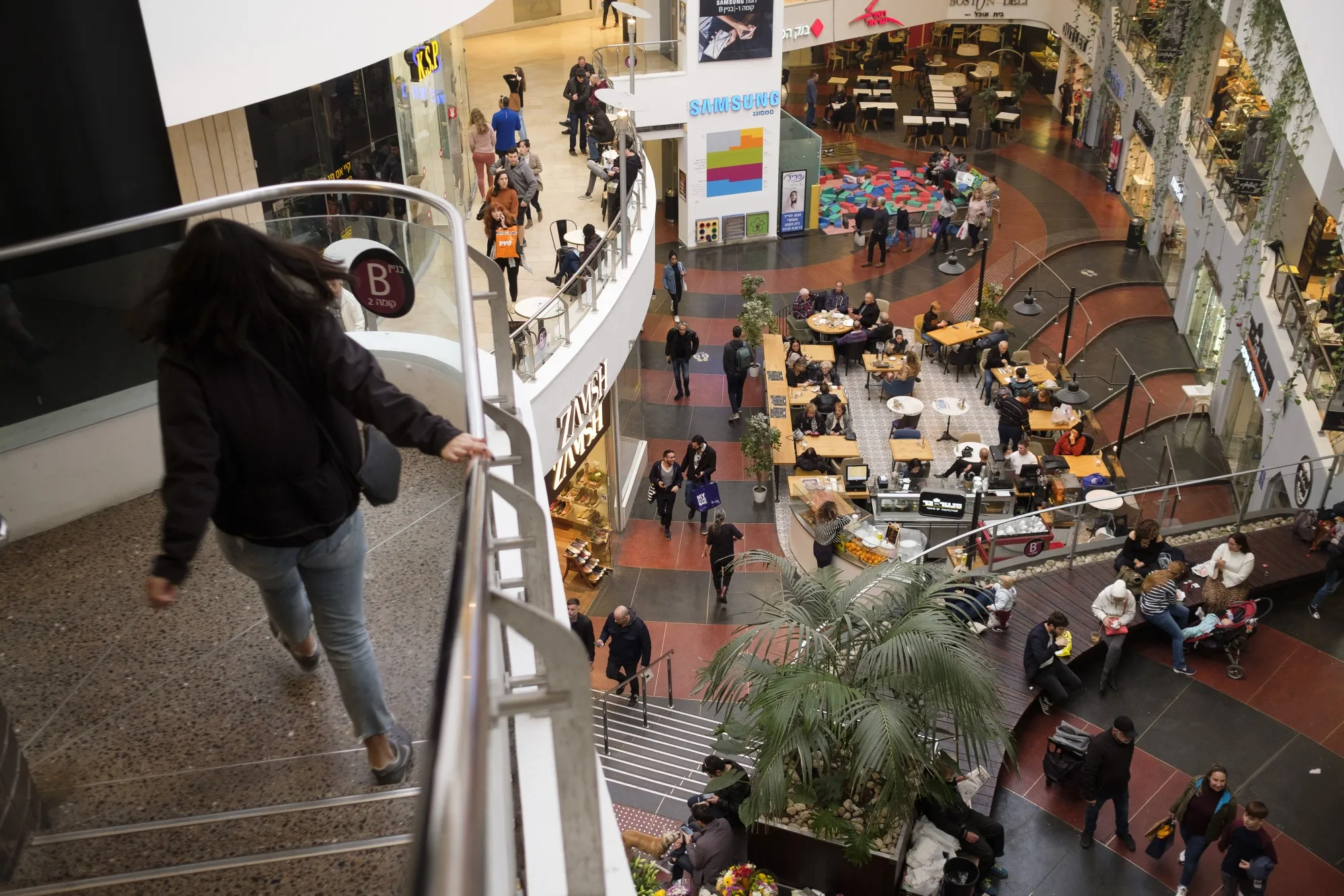 Customers dine at a food court inside the Dizingoff Center shopping mall in Tel Aviv, Israel.