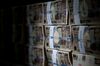 Japanese 10000 yen banknotes are stacked for a photograph at the Korea Exchange Bank headquarters in Seoul, South Korea, on Thursday, Feb. 13, 2014. The yen rose versus the dollar for a third-straight day, the longest stretch in more than three weeks, before U.S. data today that may show industrial production gains moderated, while consumer sentiment declined.