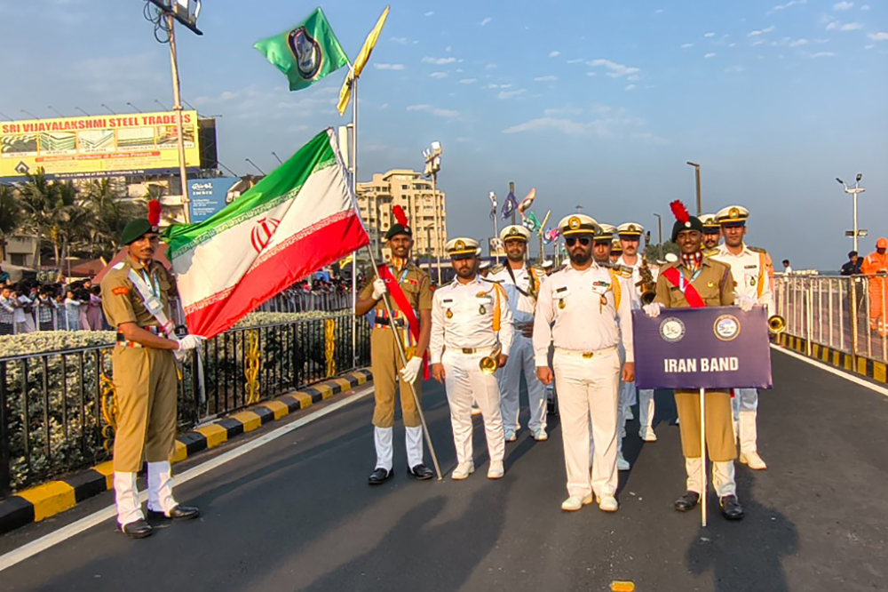 India's National Cadet Corps' Dileep Palla, center with flag, with fellow cadets Mohammed Musharraf Ali Chirsti, left, and Sumeet Kumar Sharma, join Iranian sailors marching in Visakhapatnam, on Feb. 19. Source:&amp;nbsp;Dileep Palla