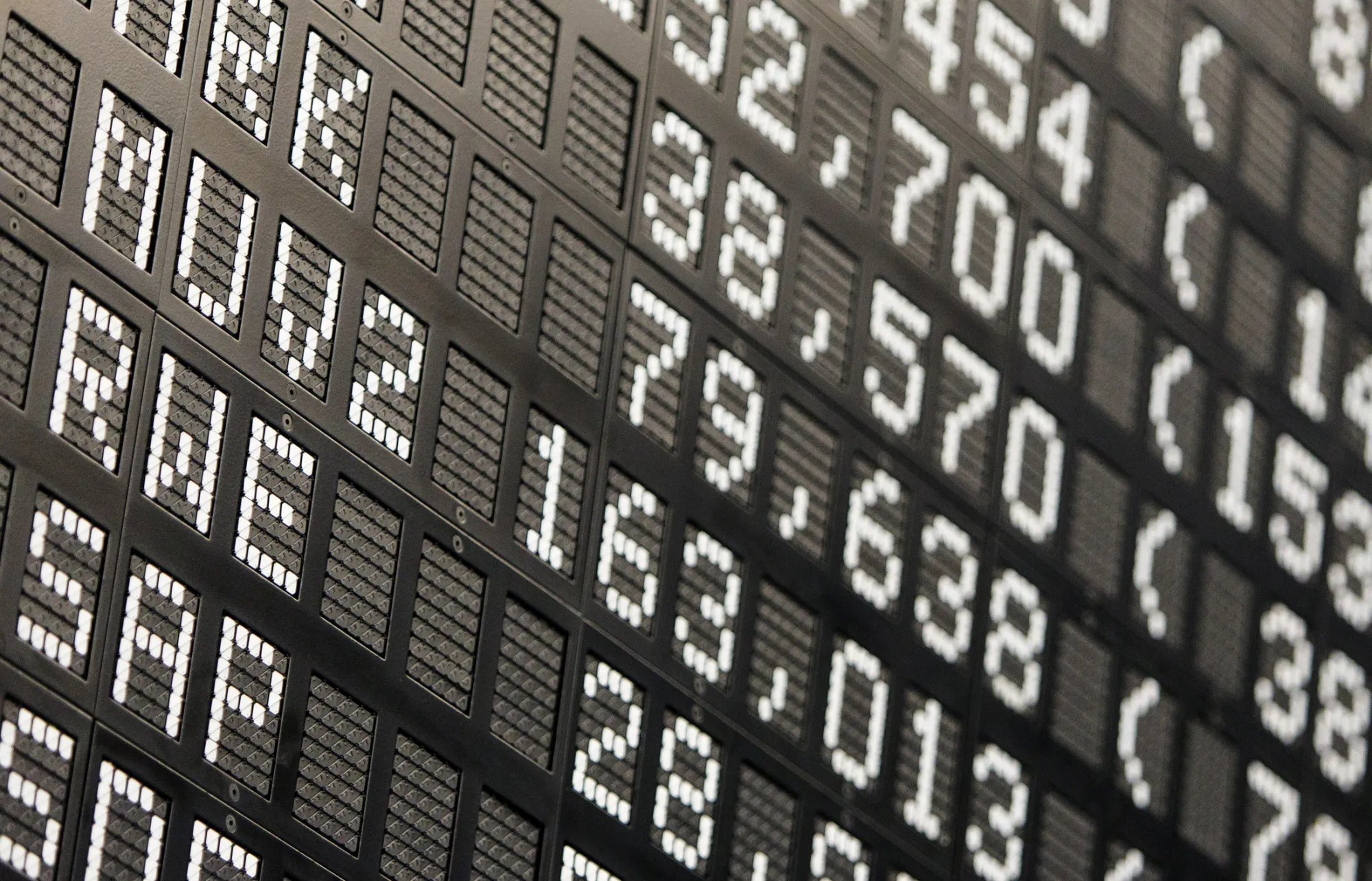 Stock prices are displayed on a financial data board at the Frankfurt Stock Exchange in Frankfurt, Germany, on Tuesday, Dec. 9, 2014. The dollar dropped amid the biggest global currency swings in a year, oil slipped and Europe stocks advanced after two days of losses.
