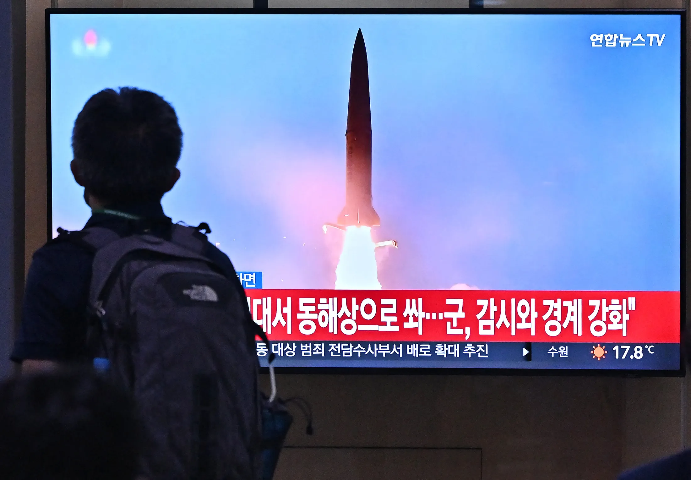 A news broadcast with file footage of a North Korean missile test, at a railway station in Seoul.
