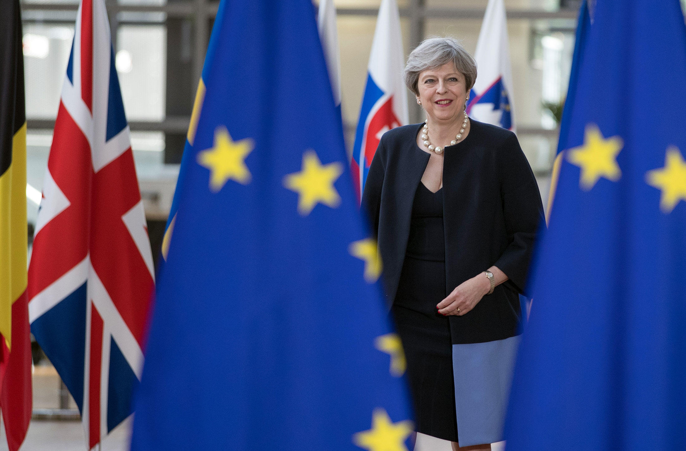 Theresa May, U.K. prime minister, arrives for a European Union (EU) leaders summit at the Europa building in Brussels, Belgium, on Thursday, June 22, 2017. EU leaders are expected to reaffirm their commitment to 'robust' free trade and the Paris Agreement on climate change when the two-day meeting concludes on Friday.
