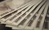 Japanese 10000 yen notes are displayed for a photograph in Tokyo, Japan, on Wednesday, Sept. 15, 2010. Japan intervened in the foreign-exchange market for the first time since 2004 after a surge in the yen to the strongest against the dollar in 15 years threatened to stunt the nation's economic recovery.