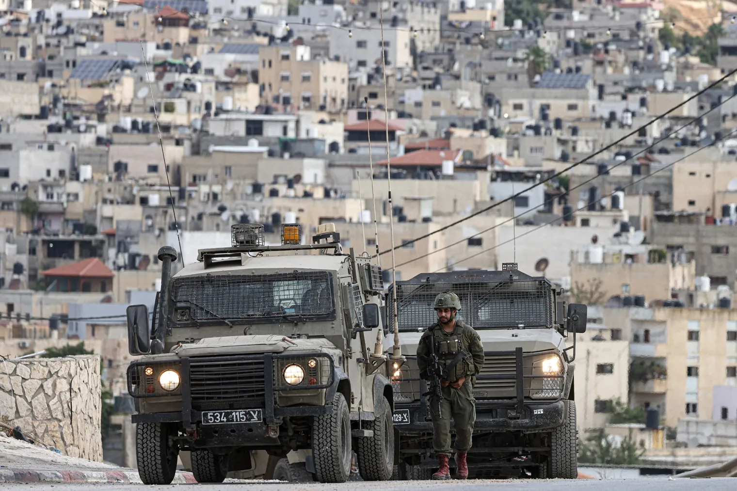 Israeli forces gather on a road during a raid at the al-Faraa camp for refugees north of Nablus in the West Bank