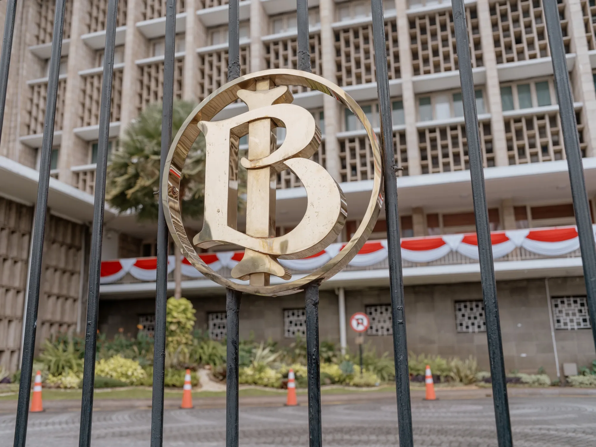The Bank Indonesia logo displayed on a fence at the central bank's headquarters in Jakarta.