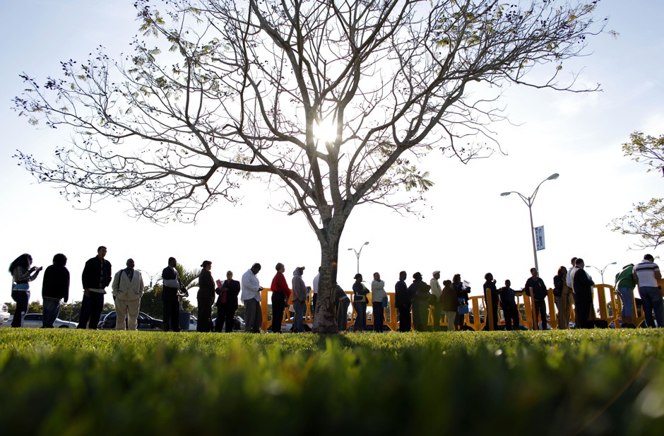 People wait in line looking for jobs during a Job Fair at the Miami Dade College in Miami, Florida in 2009. Miami-Dade county went into recession in 2007.