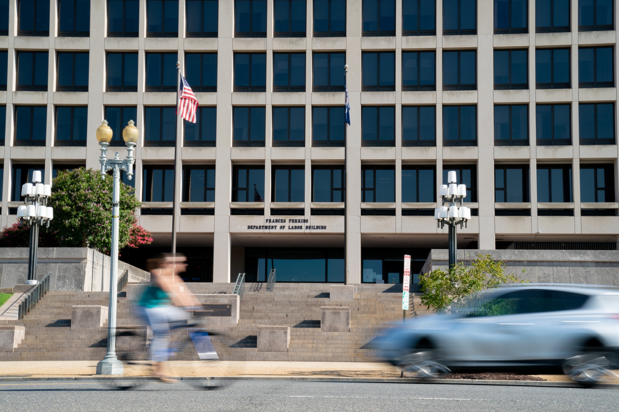 A cyclist rides past the U.S. Department building in Washington.