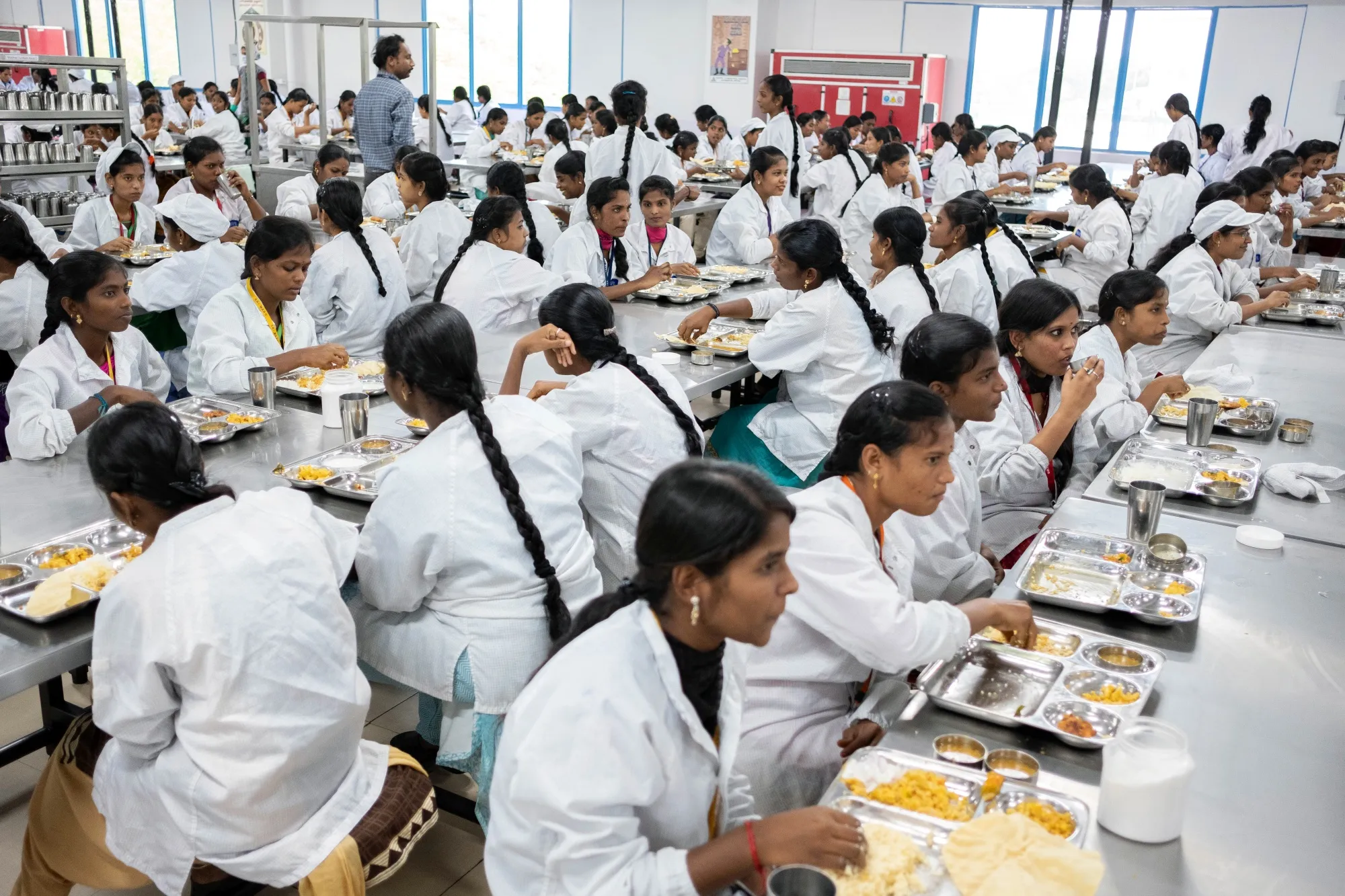 Employees eat lunch&nbsp;at the mobile phone plant of a&nbsp;Foxconn unit in Sriperumbudur, Tamil Nadu.