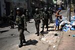 Soldiers and military police patrol the Jacarézinho Favela on Jan. 18 .