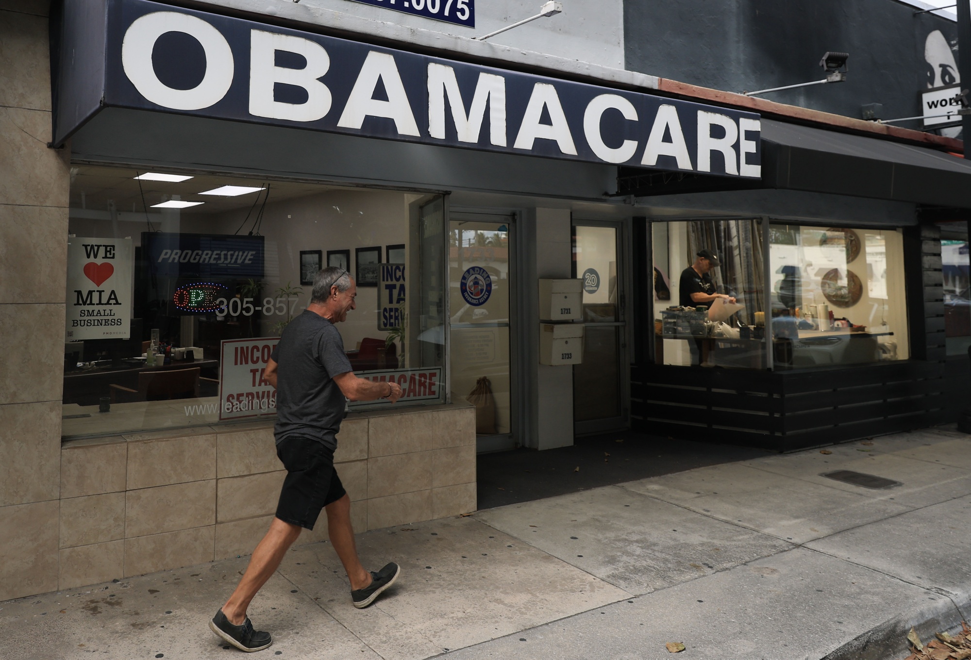 An Obamacare sign is displayed outside an insurance agency in Miami on Nov. 12, 2025. Photographer: Joe Raedle/Getty Images