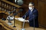 Yoshihide Suga delivers his policy speech during an extraordinary session at the lower house of the parliament in Tokyo on Monday.