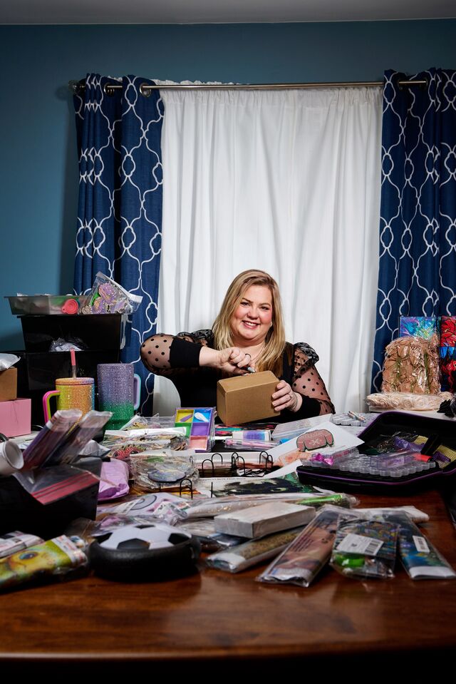 Alisha Sholtis shoots videos of her Temu hauls at her home in Davison, Michigan.