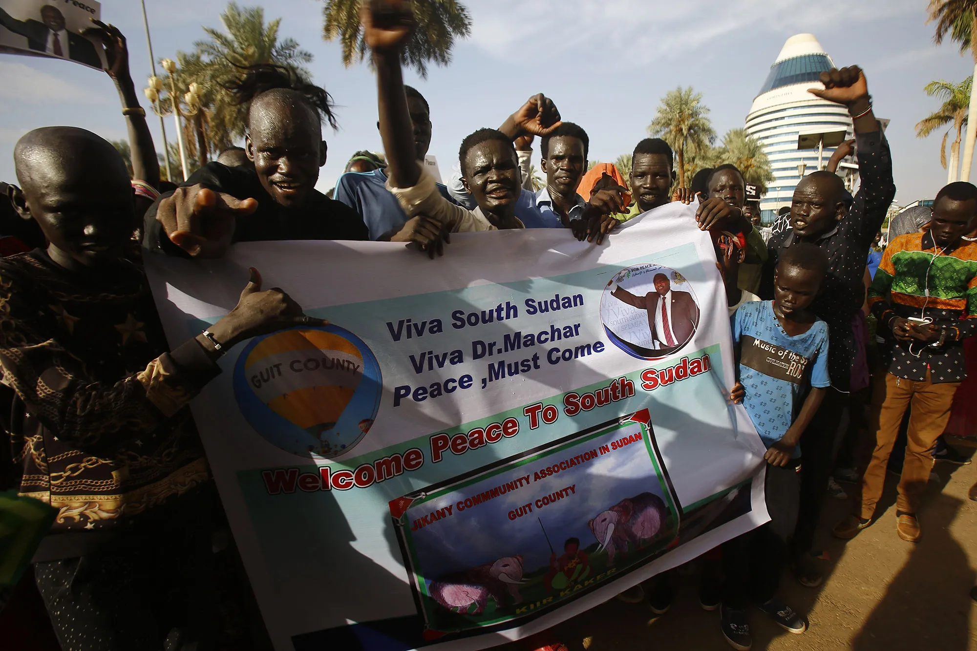 People celebrate a final South Sudanese power-sharing deal on August 5, 2018.