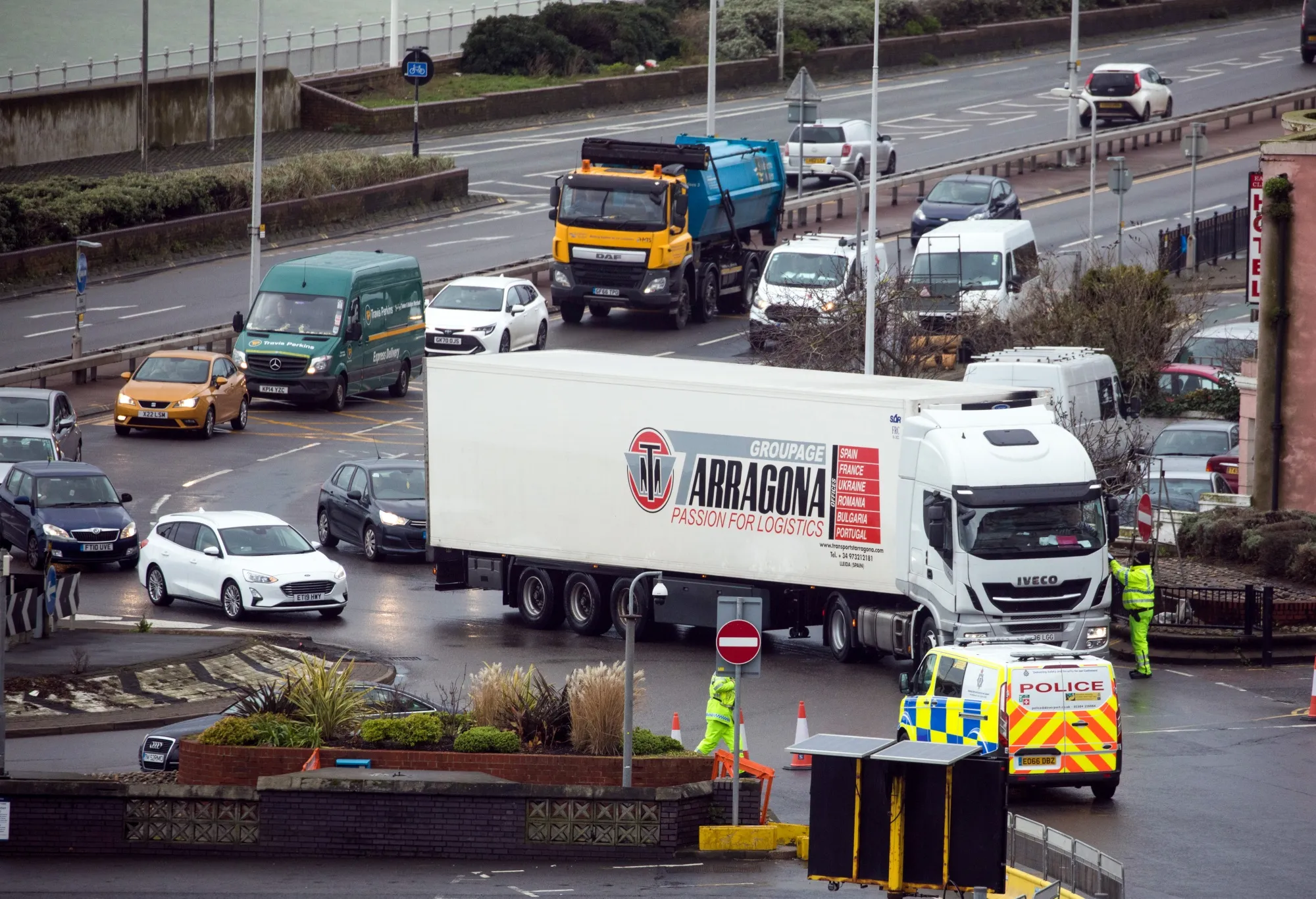 A truck driver hands over paperwork to a policeman before entering the Port of Dover in U.K., on Jan. 5.