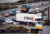 A truck driver hands over paperwork to a policeman before entering the Port of Dover in U.K., on Jan. 5.