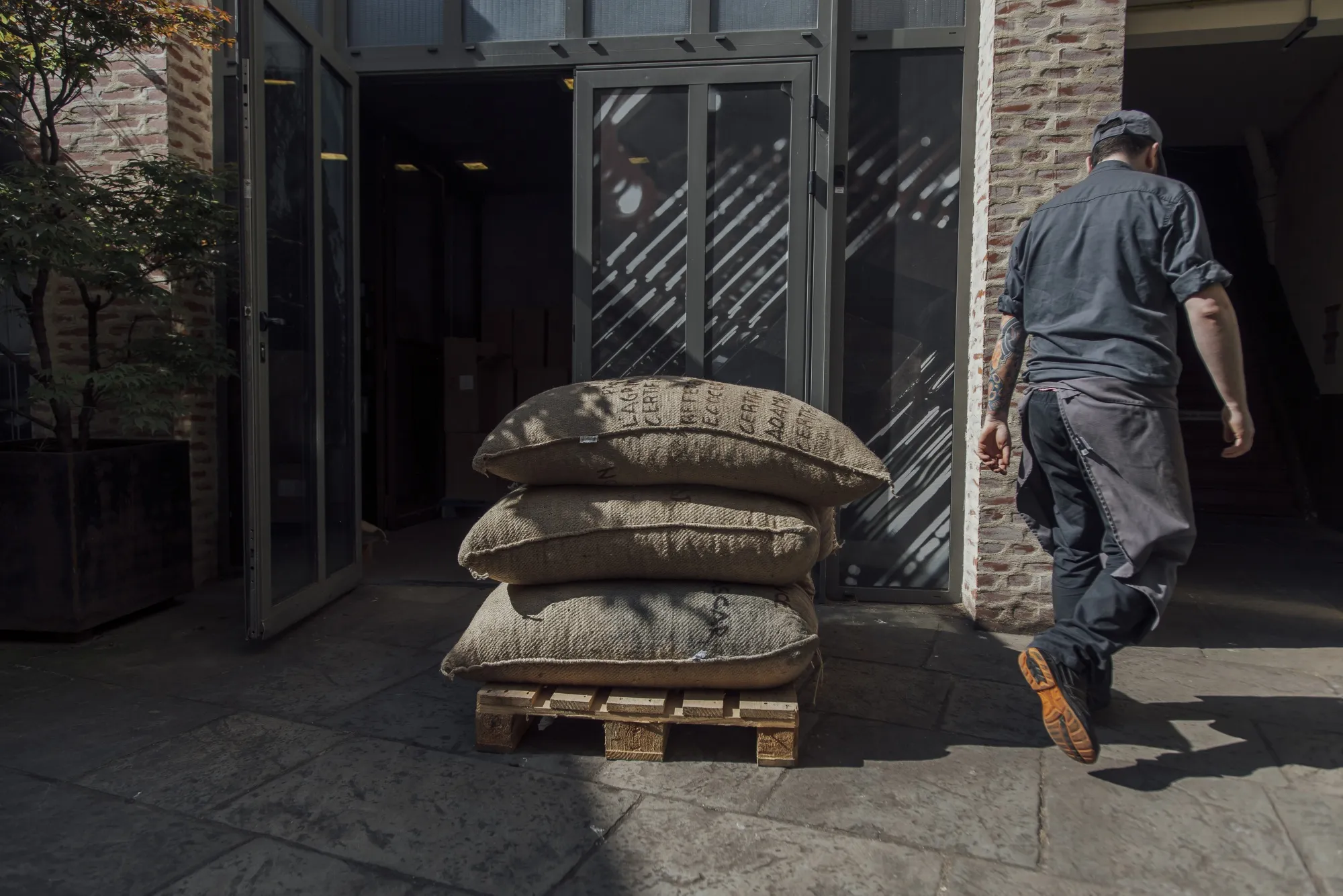 Sacks of raw cocoa beans at a chocolate factory in Paris, France.