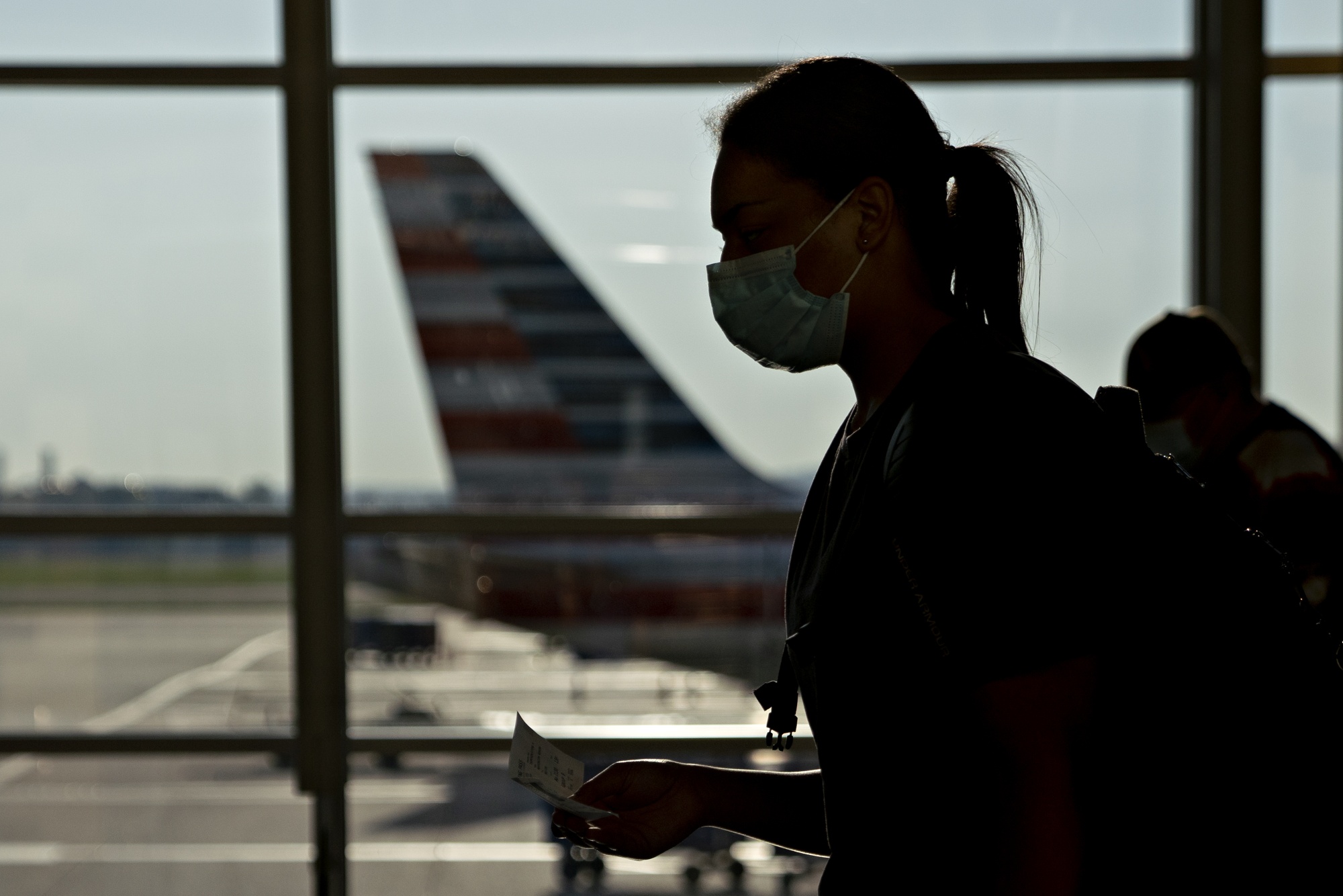 A traveler wears a protective mask&nbsp;at Ronald Reagan National Airport in Arlington, Virginia.