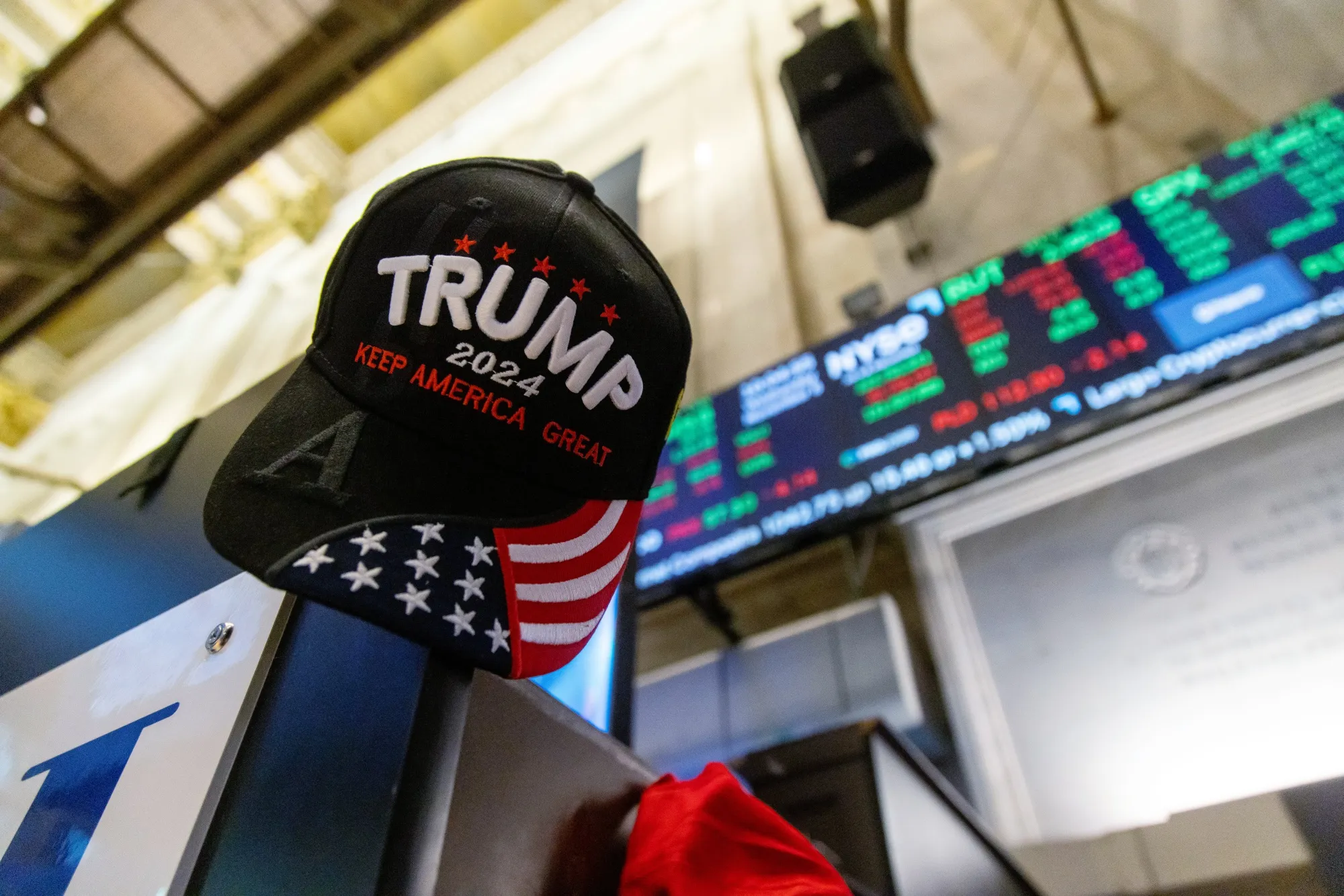 A Trump hat on the floor of the New York Stock Exchange (NYSE) in New York, US, on Wednesday, Nov. 6, 2024. Donald Trump quickly put his stamp on financial markets as his victory in the US presidential election propelled "Trump Trade" plays across assets.