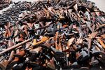 A pile of guns are displayed at a news conference after an annual Gun Buyback Program which netted 1,673 firearms at the Los Angeles Police headquarters