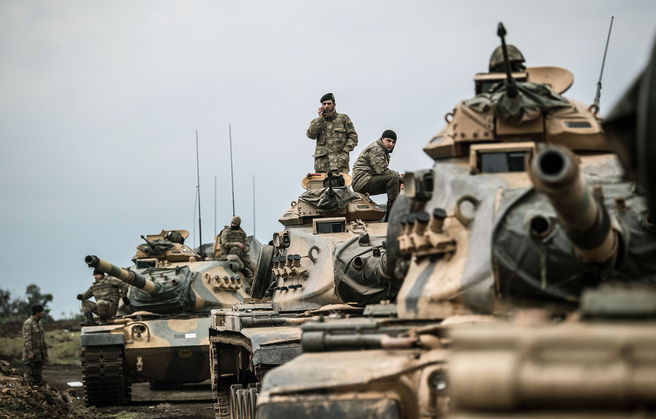 Turkish army tanks gather close to the Syrian border in 2018.