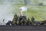 Japan Ground Self-Defense Force personnel operate an FH70 155mm field howitzer during a live fire exercise in Gotemba in 2024. Photographer: Kiyoshi Ota/Bloomberg