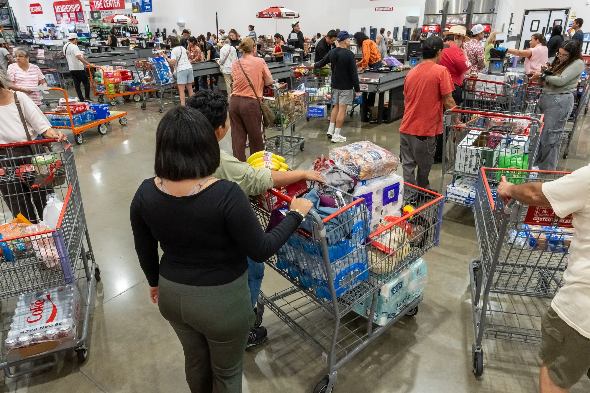 Shoppers wait to check out inside a Costco store in Napa, California.