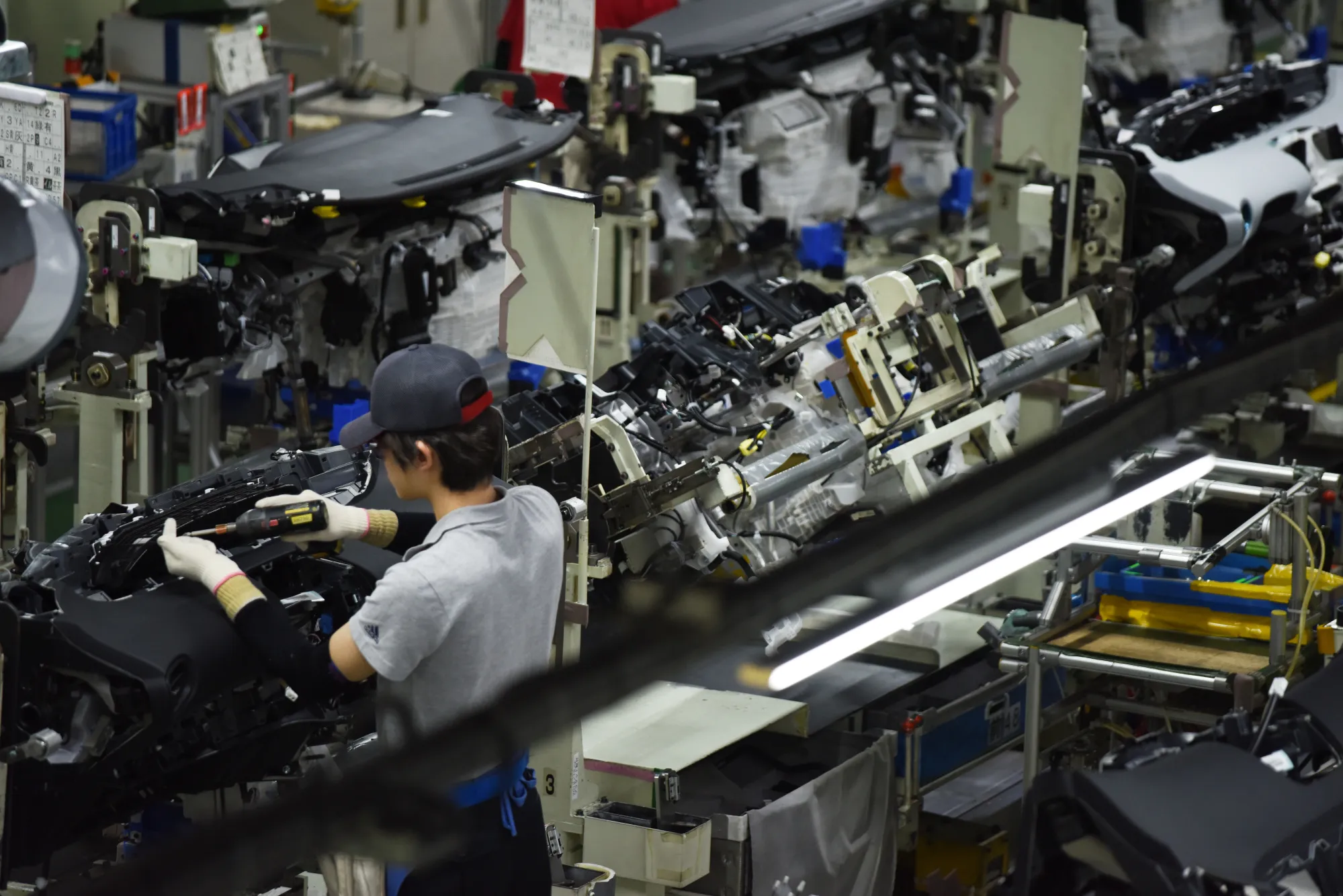 A worker assembles a vehicle on the production line of the Toyota Motor Corp. Tsutsumi plant in Toyota City, Japan.