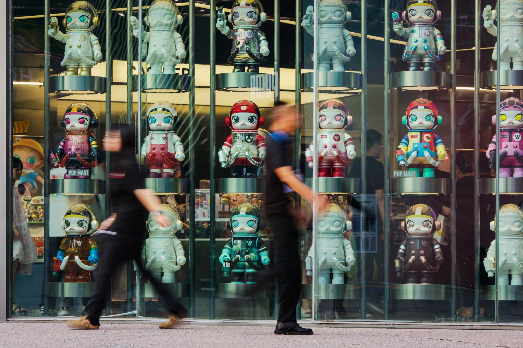 Statues of Pop Mart character Molly at one of the company's stores in Beijing, China.