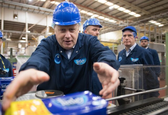 Prime Minister Boris Johnson grabs tea bags while campaigning for the election