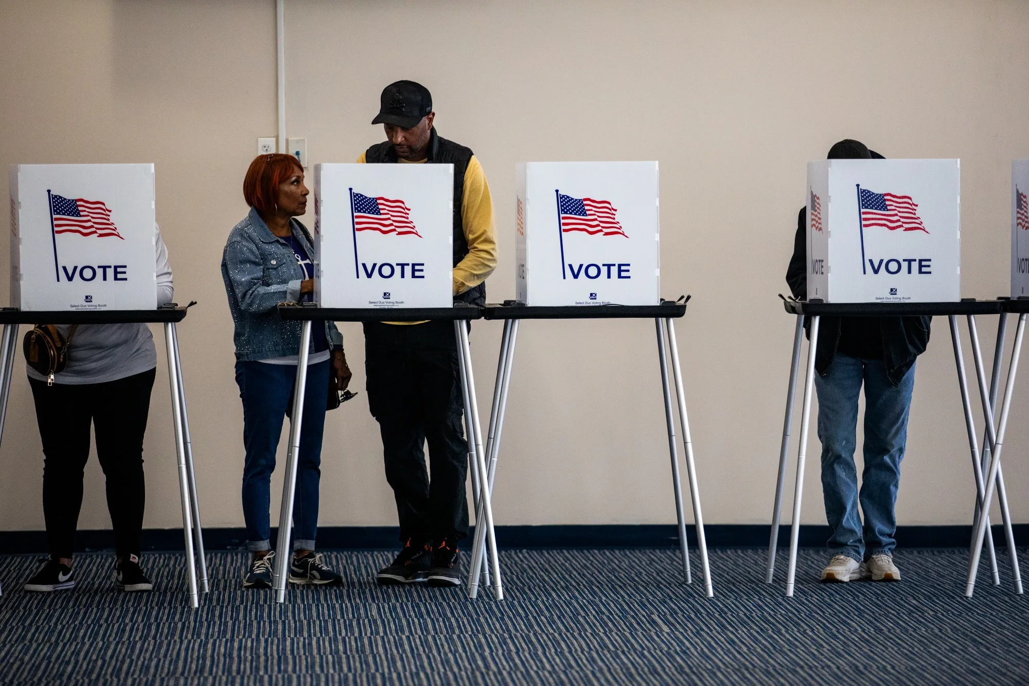 Voters cast their ballots during the first day of early voting at a polling station in Detroit, Michigan, on Oct. 19.