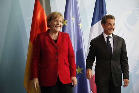 Stocks Back Sarkozy in Euro Survival as Greece, Spain Surge