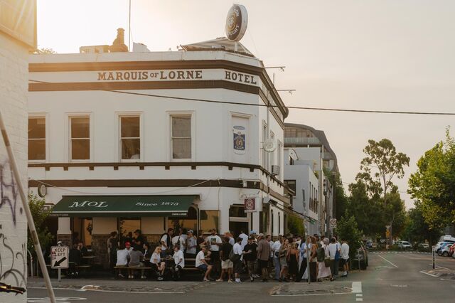 a crowd gathers outside on the corner of the Marquis of Lorne, a popular Fitzroy pub. 