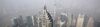 Workers clean windows of the Shanghai World Financial Center in the Pudong area of Shanghai, China.