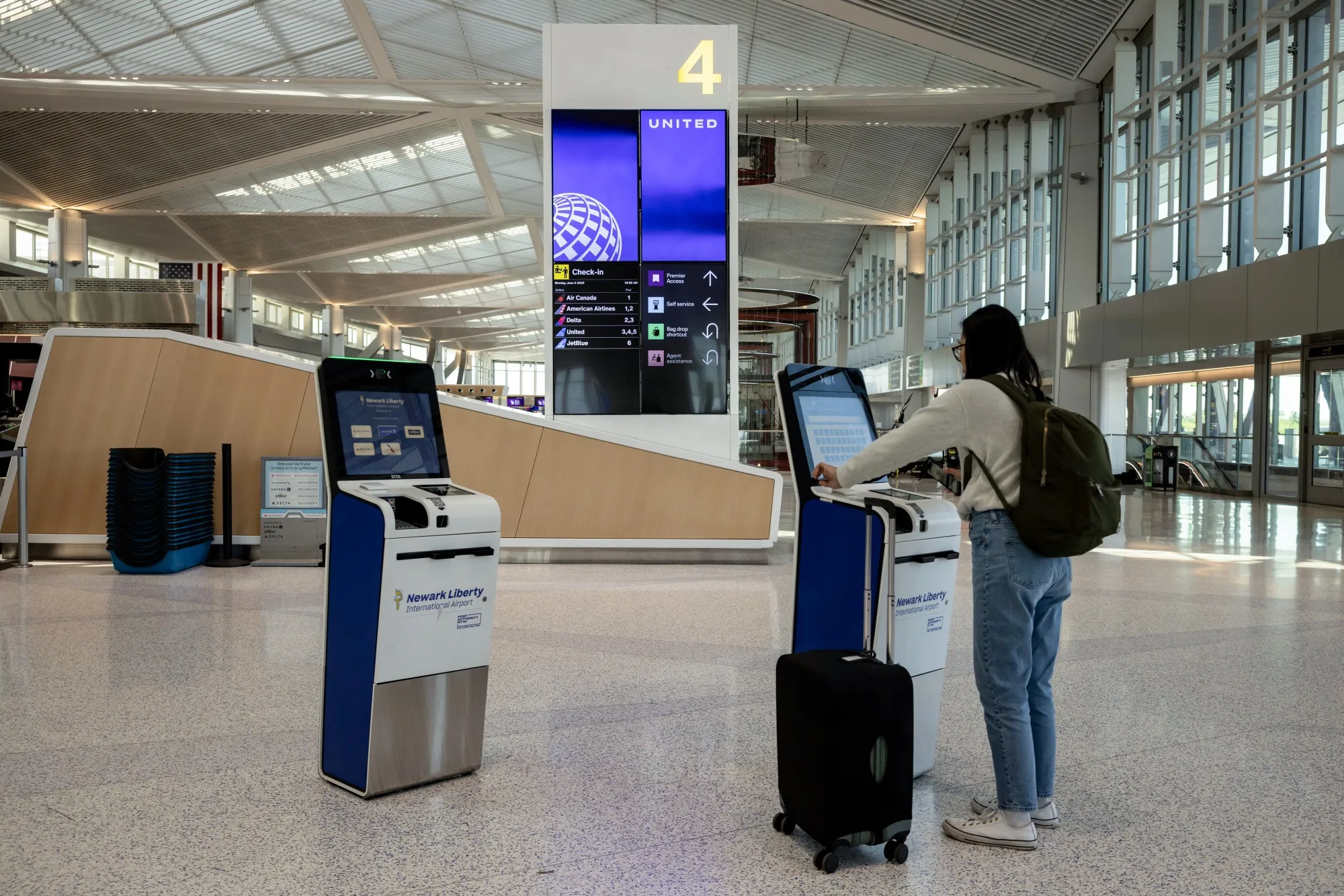 A traveler in the United Airlines check-in area at Newark Liberty International Airport in Newark, New Jersey.