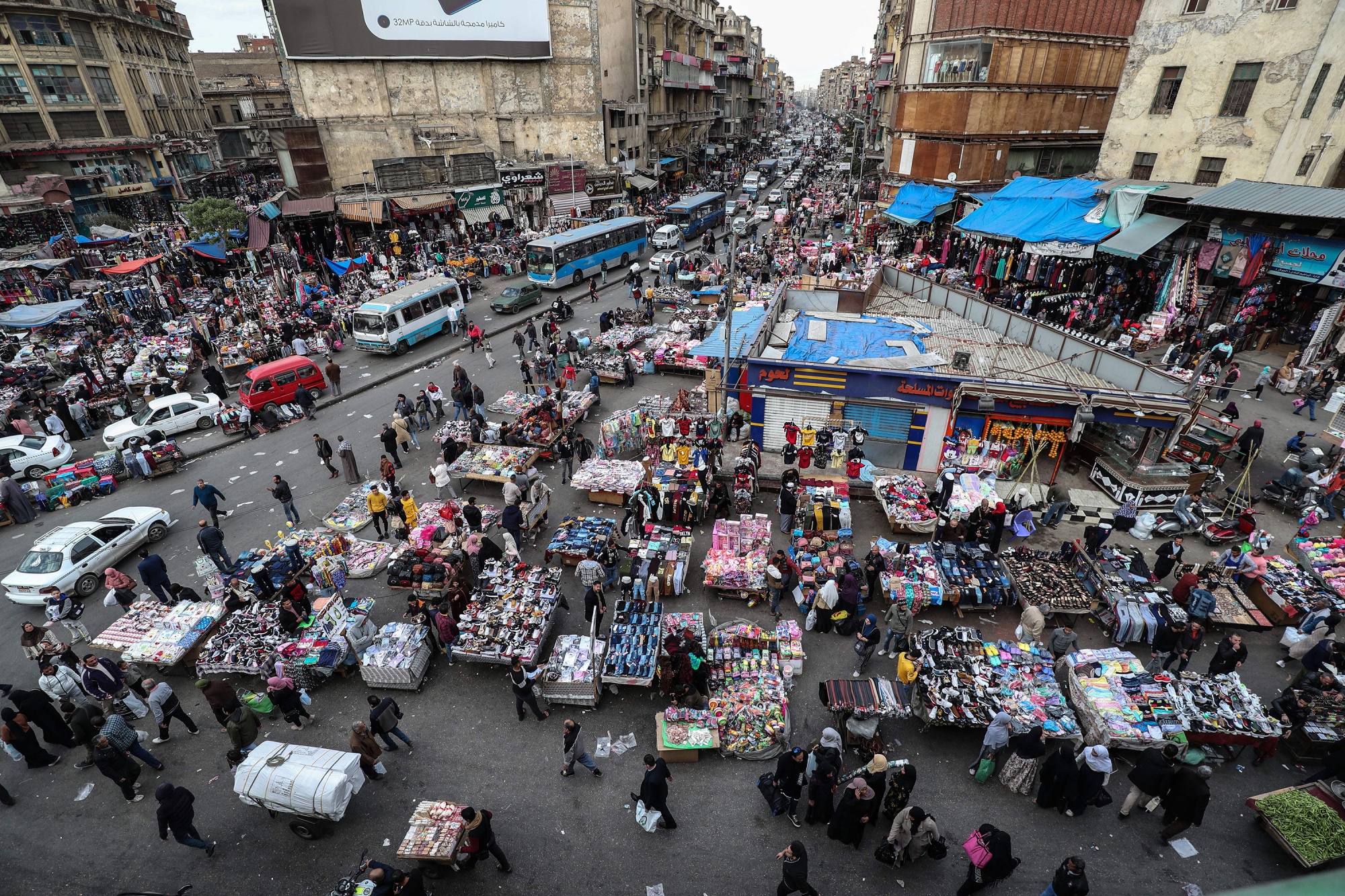 Pedestrians attend a market in&nbsp;Cairo.&nbsp;