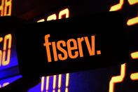 In this photo illustration, the Fiserv company logo is seen