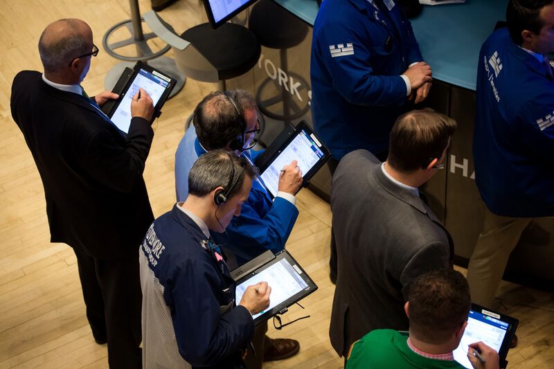 Traders work on the floor of the New York Stock Exchange (NYSE) in New York, U.S.