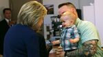 Democratic presidential candidate Hillary Clinton greets a baby on March 13, 2016, in Marion, Ohio.