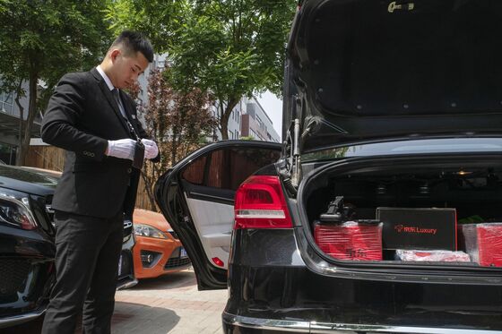 Online Shopping in China Goes Luxury, With Men in Black Delivering Hermes