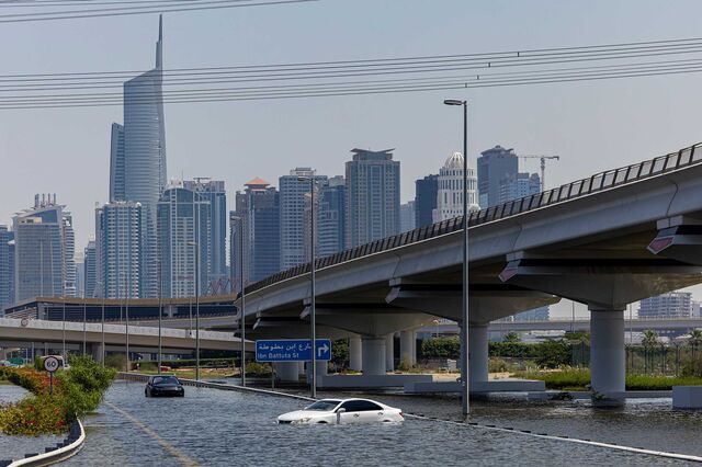 Abandoned vehicles sit submerged in water in Dubai on April 18, 2024.